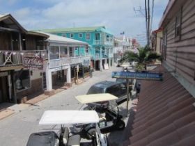 Golf carts parked along businesses in San Pedro, Ambergris Caye, Belize – Best Places In The World To Retire – International Living